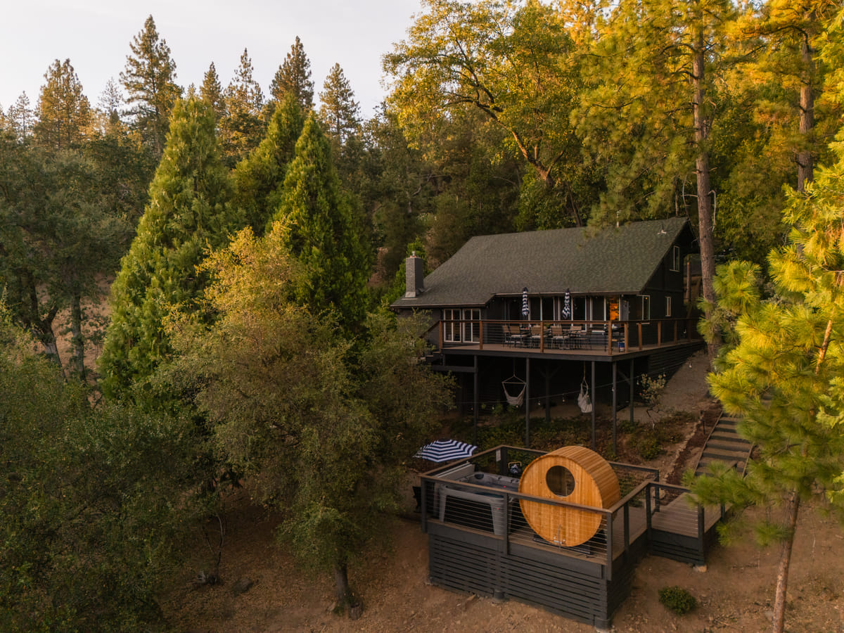 The cabin and the sauna deck from above in daylight